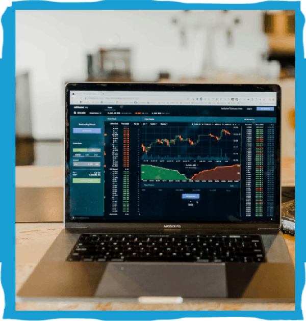 Laptop displaying trading chart