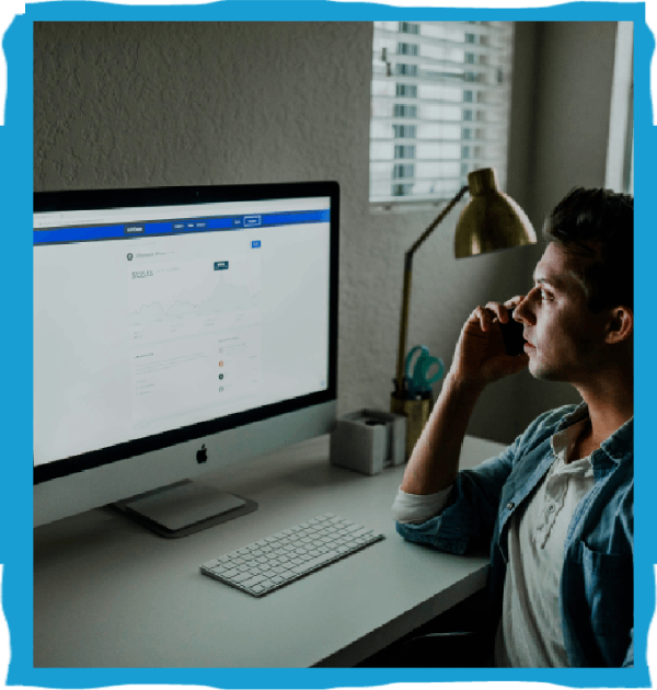 Person on phone at computer