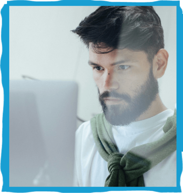 Man focused on computer screen